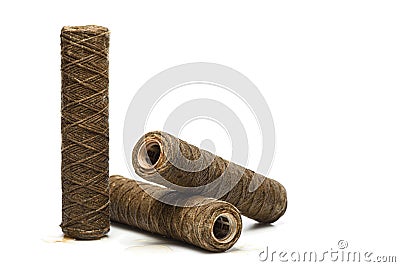 Set of used rope water filters on white with copy space. Clogged and dirty string water filters Stock Photo