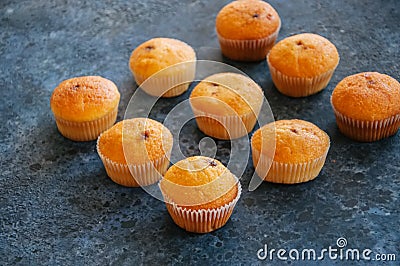 Set of vanilla muffins with chocolate cream filling. Blue stone Stock Photo