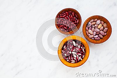 Set of various dried kidney legumes beans in wooden bowls Stock Photo