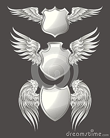 Set of vector angelic or bird wings with heraldic shields Vector Illustration