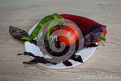 Set of vegetables isolated on wood table background. Green and red bell pepper backgro. Basil and tomato Stock Photo