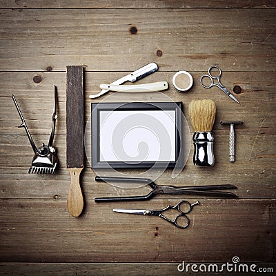 Set of vintage tools of barber shop with empty picture frame Stock Photo