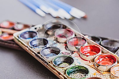 Set of watercolor paints and paintbrushes for painting close up Stock Photo