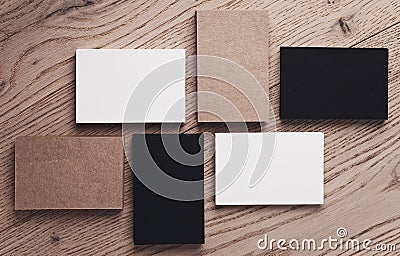 Set of white, black and craft business cards on wood table. Top view. Horizontal Stock Photo