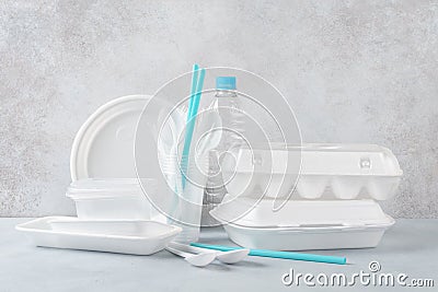 Set of white plastic disposable tableware and packaging Stock Photo