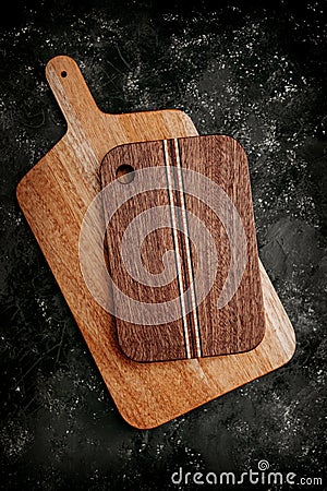 set of wooden cuttng boads on black background. Wooden kitchen block close up Stock Photo