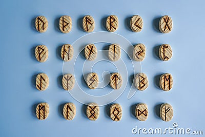 Set of the wooden scandinavic runes in the blue background Stock Photo