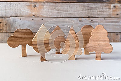 Set of wooden trees handmade. Waldorf toys on wooden background Stock Photo