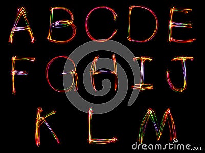 Set of word writing from light on the black background. Stock Photo