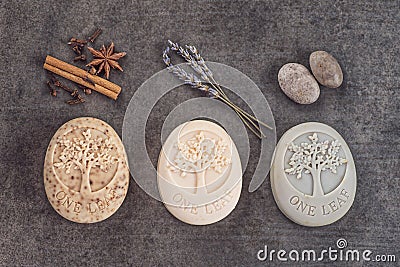 Sets of handmade ornamental soaps on black board, product of cosmetics or body care Stock Photo