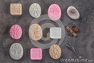 Sets of handmade ornamental soaps on black board, product of cosmetics or body care Stock Photo