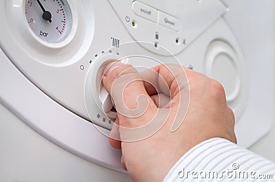 Setting the central heating level. Stock Photo