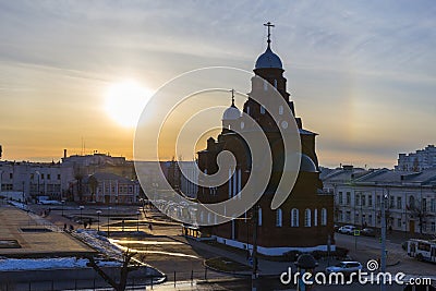 The setting sun illuminates the walls of the old Trinity Church. Stock Photo