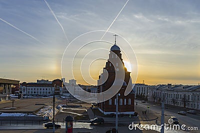 The setting sun illuminates the walls of the old Trinity Church. Editorial Stock Photo