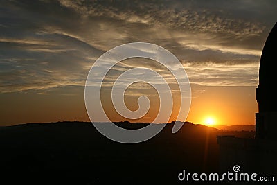 Setting sun next to an observation deck Stock Photo