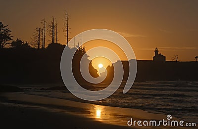 Setting Sun Reflections on a Remote Beach Stock Photo