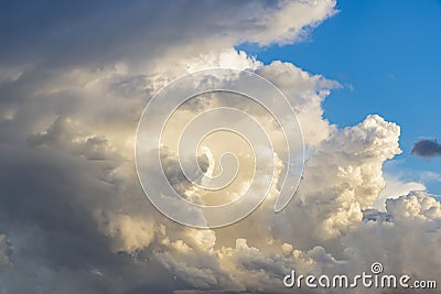 The setting sun shines on a large part of this enormous thundercloud above Zoetermeer Stock Photo