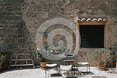 Setting of terrace of cafeteria or luxury hotel in Mallorca, Orient. one of the most beautiful villages in mallorca Stock Photo