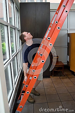Setting Up a Ladder Stock Photo