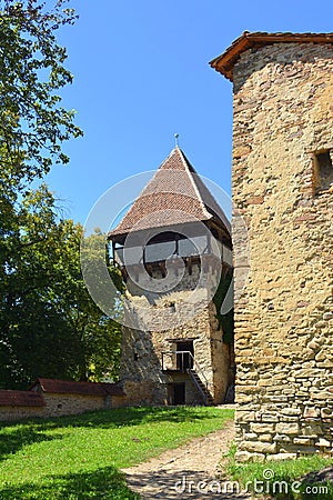 Tower and walls of the fortified medieval church in the village Mesendorf Meschenderf, Meschendorf, Mesche Stock Photo