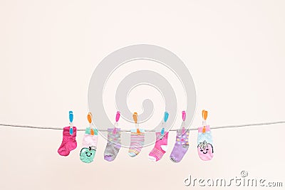 Seven Babies Socks On Washing Line Landscape Stock Photo