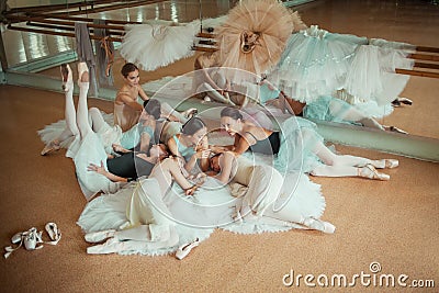 The seven ballerinas against ballet bar Stock Photo