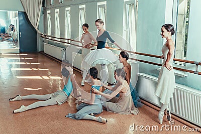 The seven ballerinas at ballet bar Stock Photo