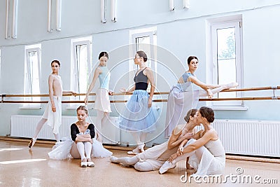 The seven ballerinas at ballet bar Stock Photo