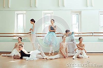 The seven ballerinas at ballet bar Stock Photo