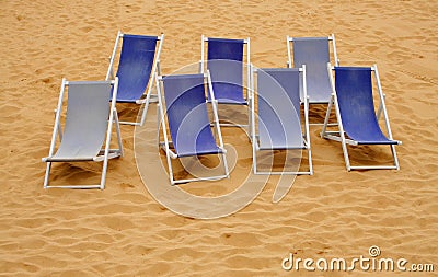 Seven beach chairs Stock Photo