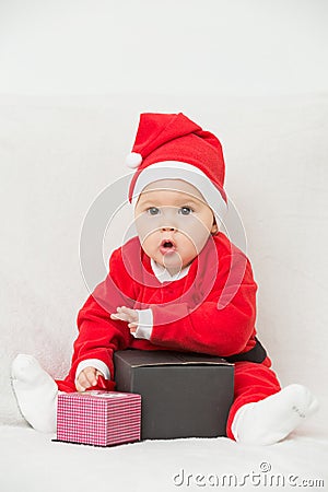 Seven months old baby girl in Santa Claus dress Stock Photo