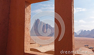 Seven Pillars of Wisdom seen from a window. Beautiful rock formation on entry in Wadi Rum Stock Photo