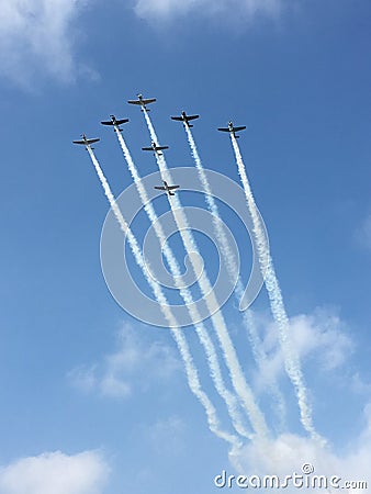 Seven Planes In Arrow Formation With White Smocks Wallpaper Stock Photo