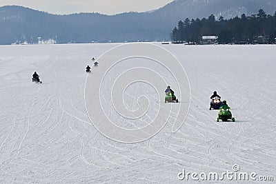 Seven snowmobiles on Lake Pleasant Stock Photo