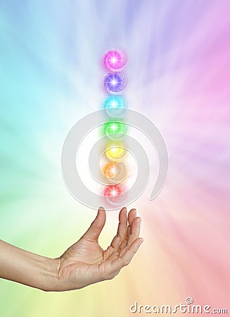 Seven Spinning Chakras on Rainbow colored background Stock Photo