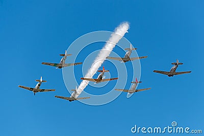 Seven AT-6 Texans With Single Smoke Trail Editorial Stock Photo