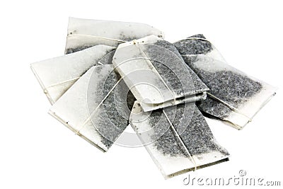 Seven Unused Tagged Teabags Placed in a Pile Stock Photo