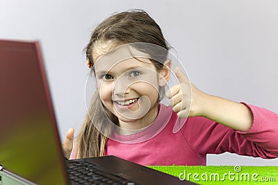 Seven-year old girl with laptop Stock Photo