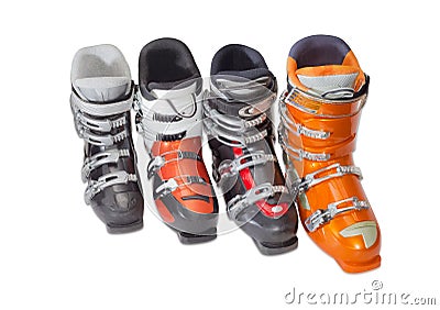 Several alpine ski boots on a light background Stock Photo