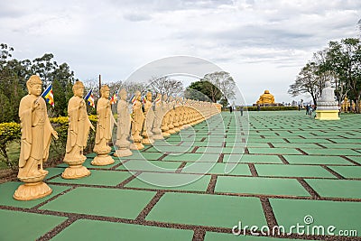 Several Buddha statues in perspective at the buddhist temple Editorial Stock Photo