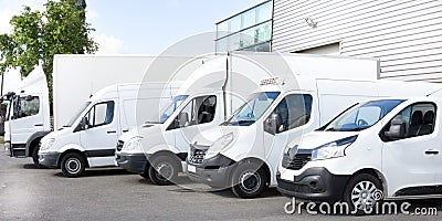 Several cars vans trucks parked in parking lot for rent Stock Photo