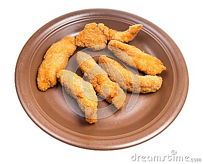 several chicken strips on brown plate isolated Stock Photo