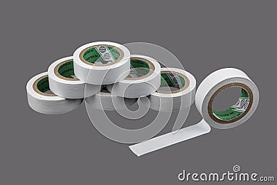 Several coils of colored tape insulating tape on black background. Adhesive tape on a black background. View from above Stock Photo