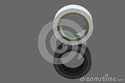 Several coils of colored tape insulating tape on black background. Adhesive tape on a black background. View from above Stock Photo