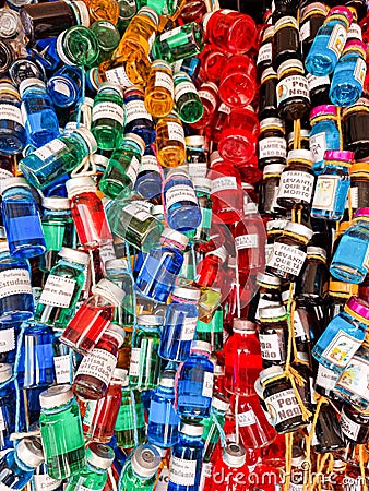 Several colorful bottles of homemade medicine, garrafada, cure, healer. Editorial Stock Photo