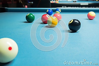 Several colorful pool balls on the pool table Stock Photo