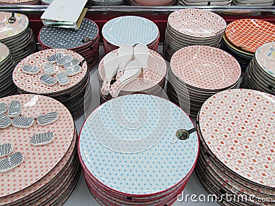 Several colourful clay porcelain bowls utensils for sale on display Stock Photo