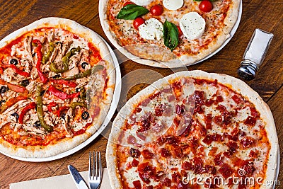 Several different pizzas Stock Photo
