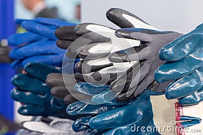 Several different textile rubber gloves for workers for protection and safety Stock Photo