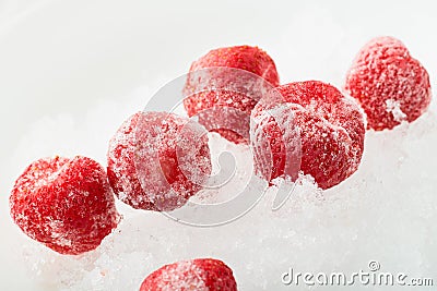 Several frozen strawberries on ice: concept of freezing foods Stock Photo